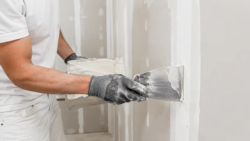 Drywall contractor at work